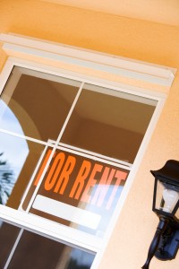A For Rent sign in the window of a residence