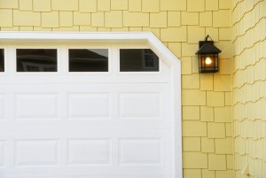 Detail of Garage Door on Yellow Shingled House