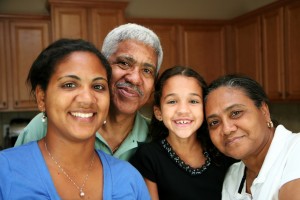 Retiree with family together in the kitchen